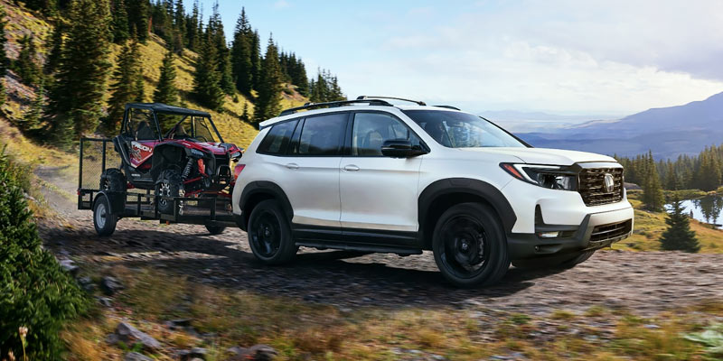 A white 2025 Honda Passport SUV available at Honda of New Rochelle.