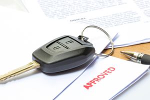 Car keys on an approved Credit Application.