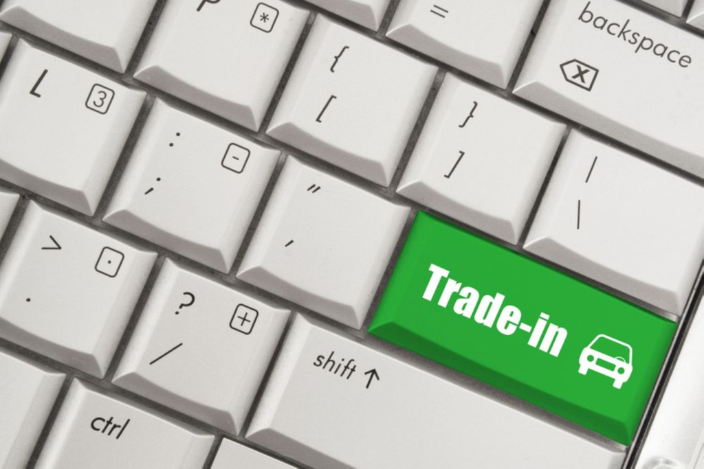 A keyboard with a green "Trade-in" key featuring a car icon.